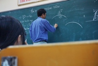 teacher at chalkboard