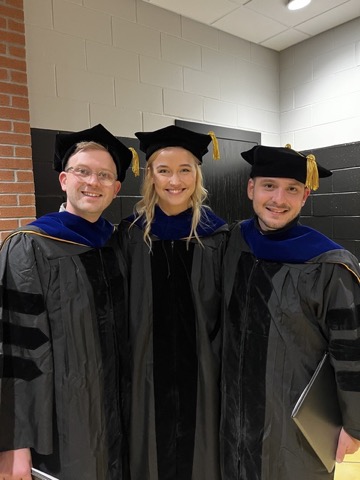 Philip Stoner, Savannah Merold, and Michael Lester at graduation